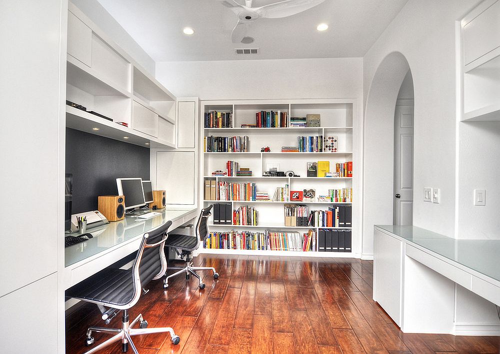 Custom built-in bookshelf brings color to this white home office