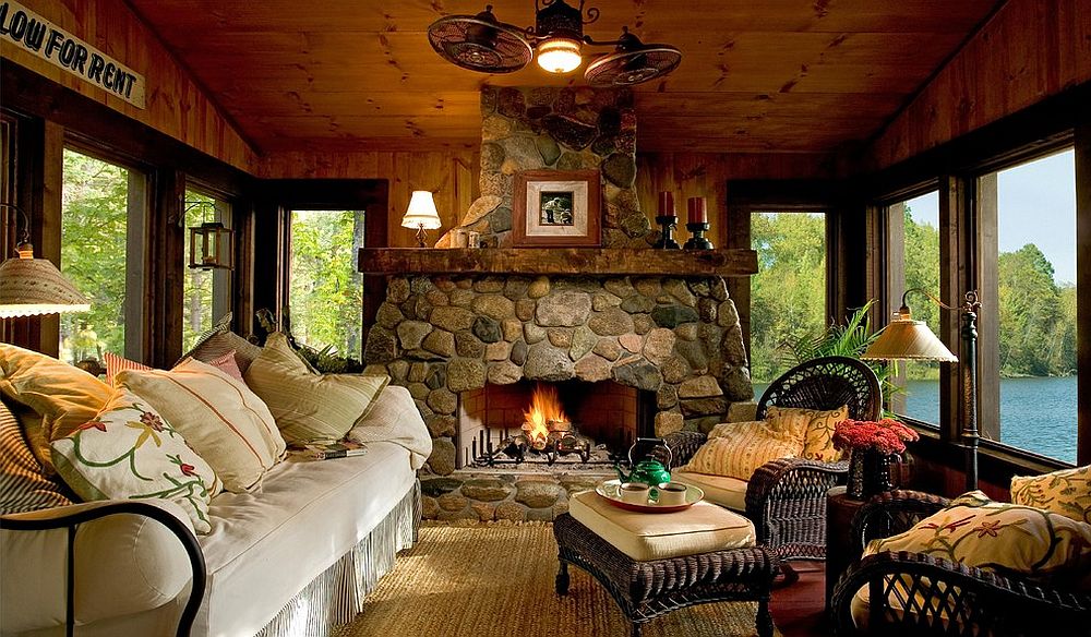 Custom stone fireplace elevates the style quotient of the beautiful rustic sunroom [Design: Lands End Development - Designers & Builders]