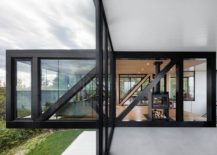 Dark-framed-glass-walls-give-the-elegant-chalet-its-unique-modern-vibe-217x155