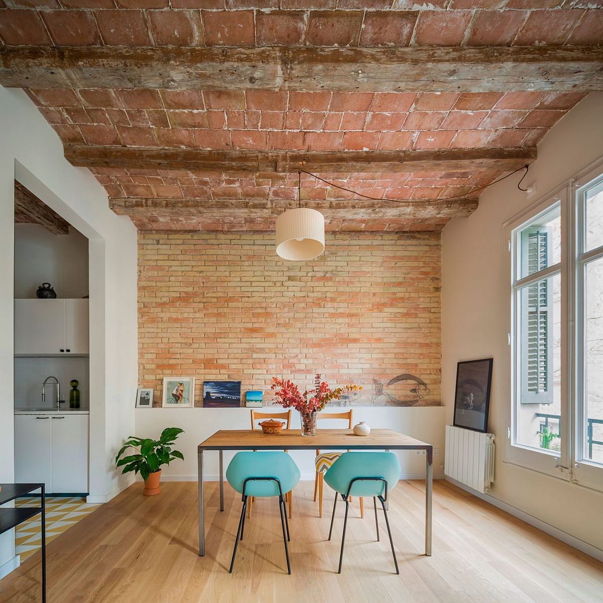 Dining room of renovated home in Barcelona with iconic chamfered corners