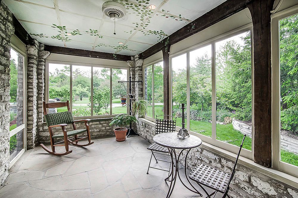 Exposed brick walls and unique ceiling turn the sunroom into an extension of the landscape [From: Adam Bradshaw, Bradshaw Photography]