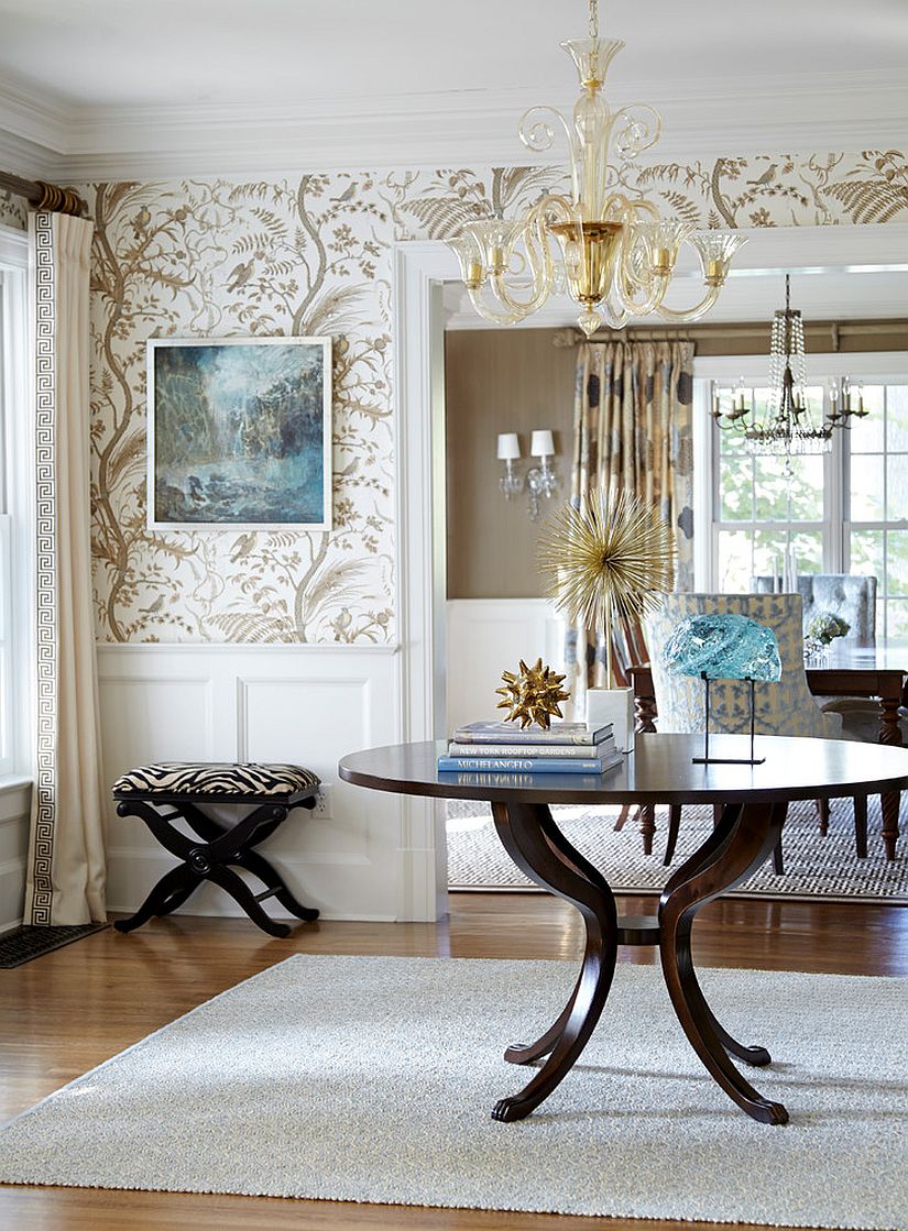 Fabulous entry room with a central table and wallpapered walls