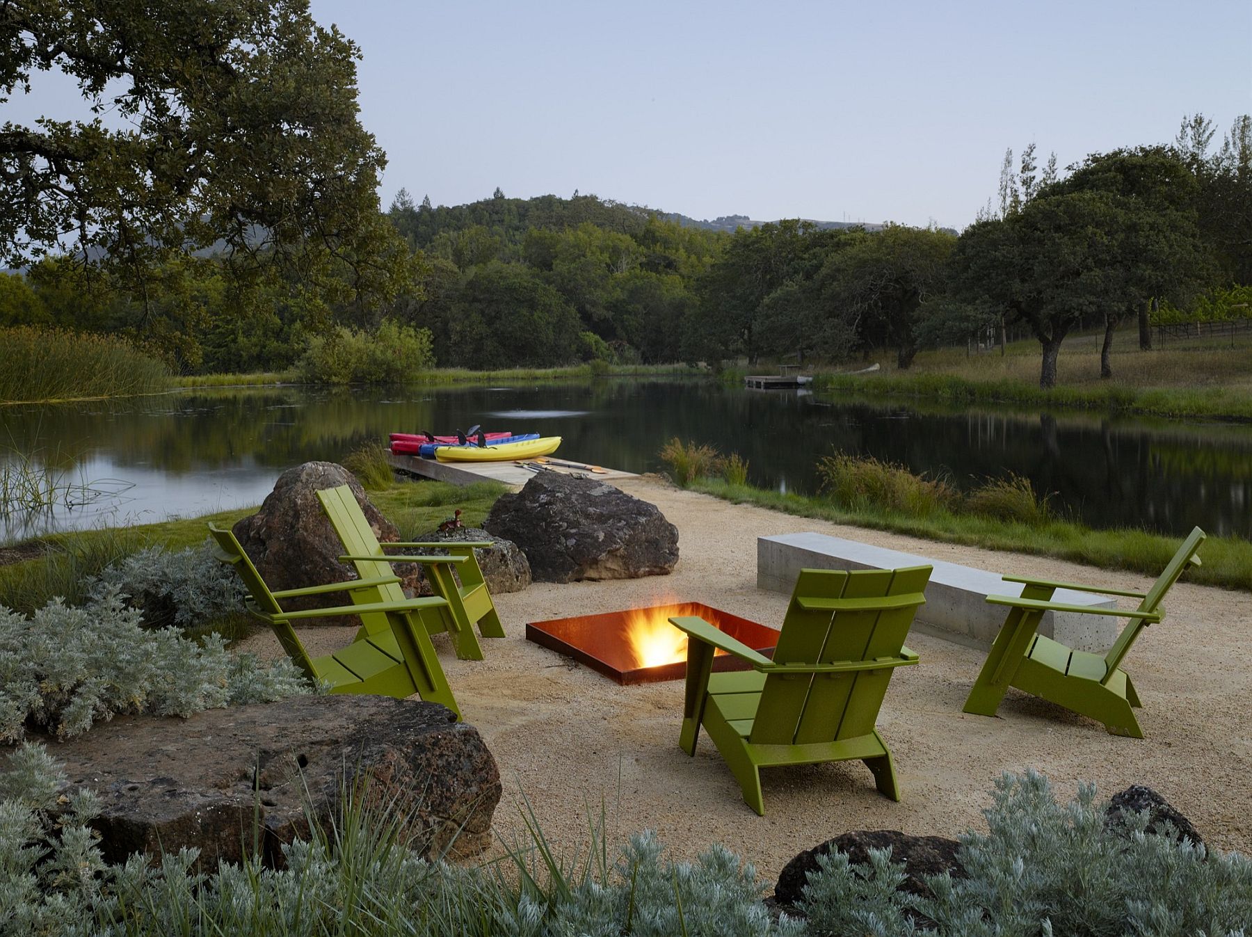 Firepit and informal seating on the edge of the natural pond and spring