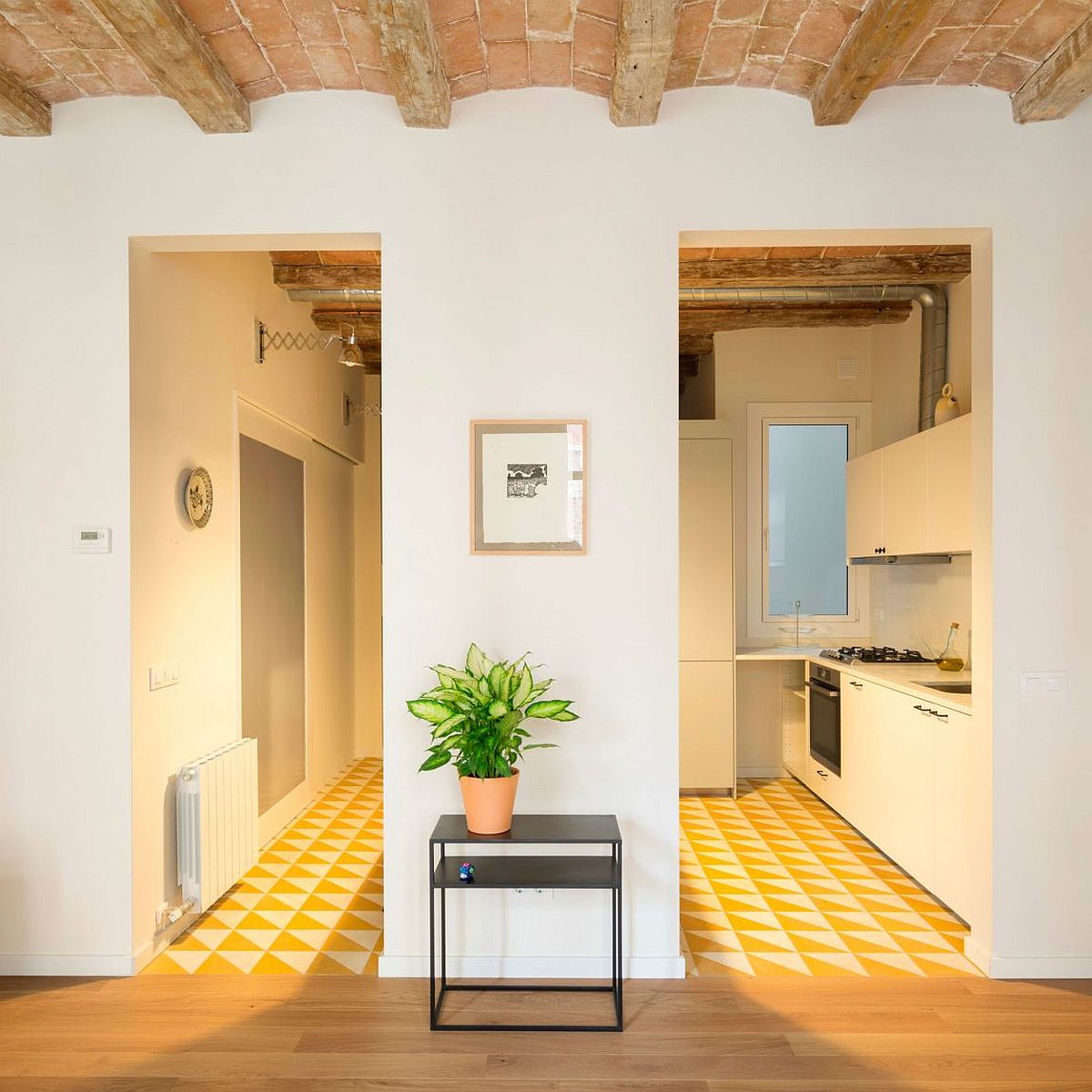 Floor tiles bring a wall yellow glow to the kitchen and interior