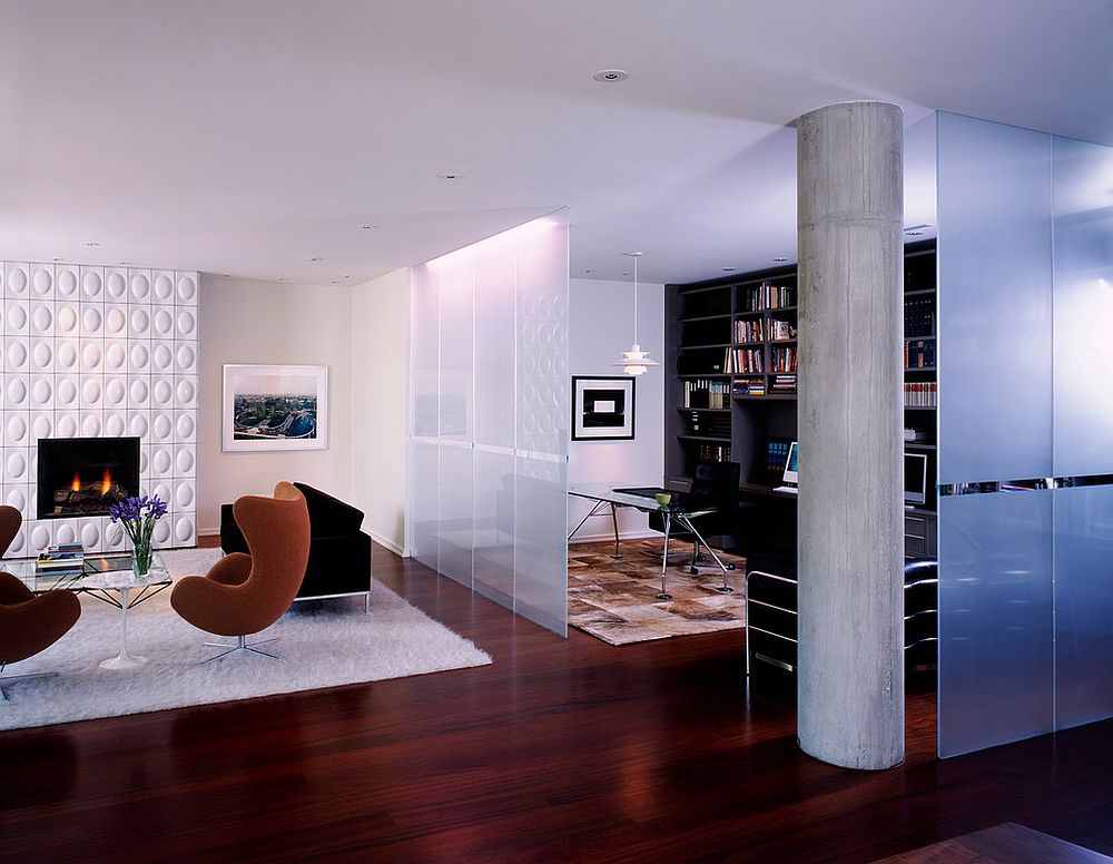 Frosted glass room divider separates the modern living room from the beautiful home office [Design: Morlen Sinoway Atelier]