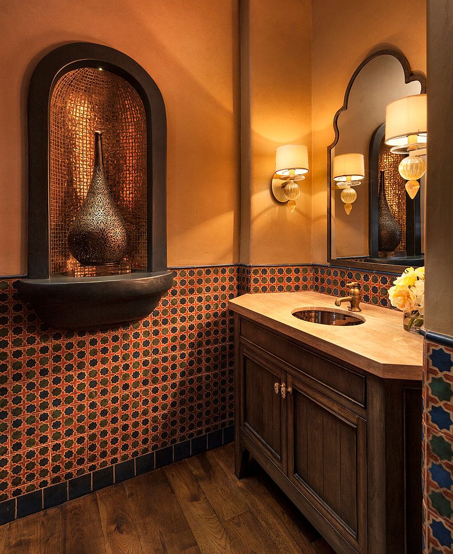 Gorgeous Mediterranean powder room in orange with wooden vanity