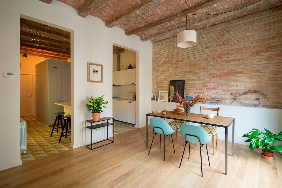 Gorgeous dining space with exposed brick walls and ample natural light