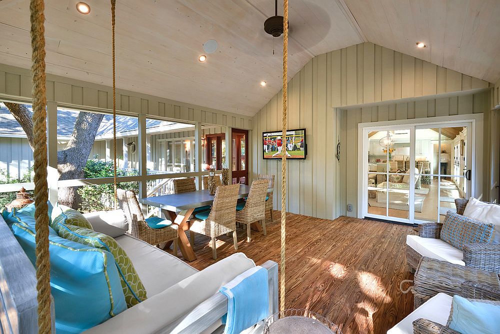 Hanging daybed and dining inside the sunroom [From: William Quarles Photography]