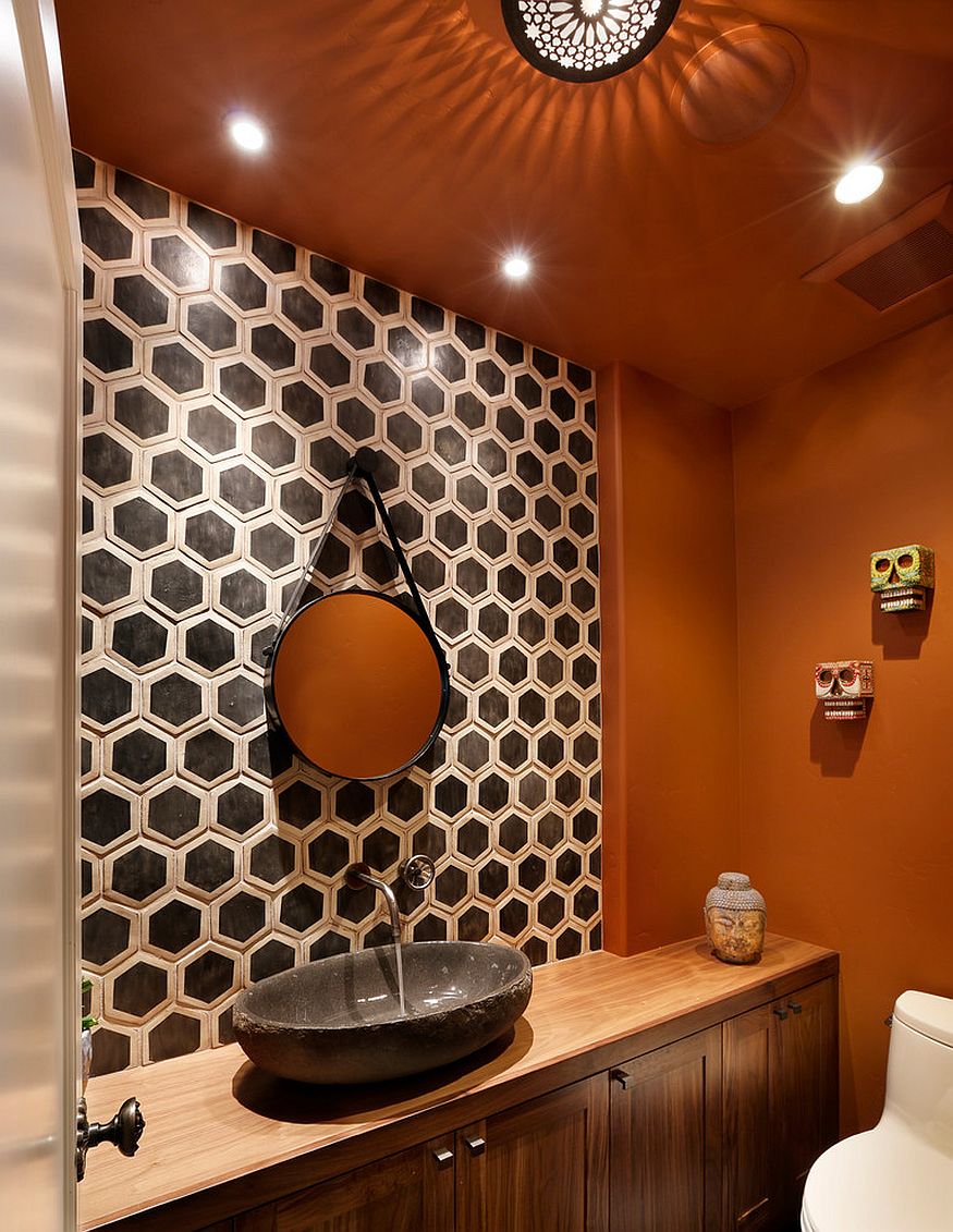 Hexagonal tile pattern brings geometric contrast to the powder room in orange