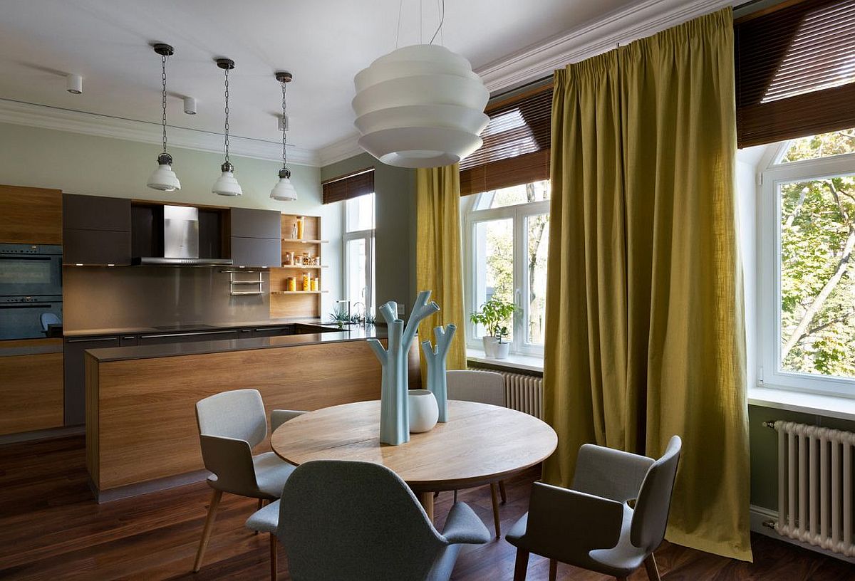 Kitchen and dining room of the Kiev home with woodsy warmth