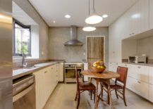 Kitchen-with-neutral-color-palette-and-cement-walls-217x155