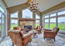Large-glass-windows-and-doors-and-stone-flooring-shape-the-rustic-sunroom-217x155