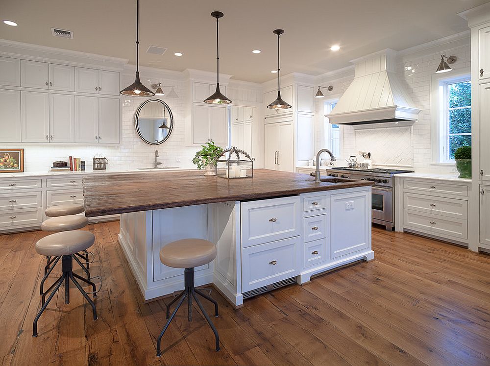 Large reclaimed wood counter top for the kitchen island with breakfast zone [From: Carl Mayfield Architectural Photography]