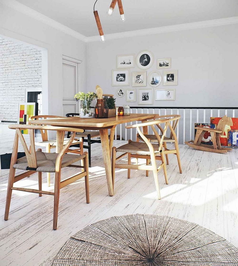 Light-filled Scandinavian dining area with wishbone chairs and wooden table