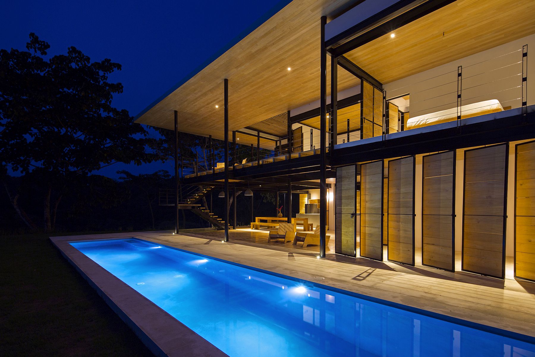 Lighting showcases the open and breezy Costa Rican home in a completely different light!