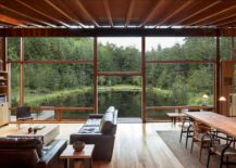 Living-room-flows-into-the-overgrown-landscape-and-the-manmade-pond-217x155