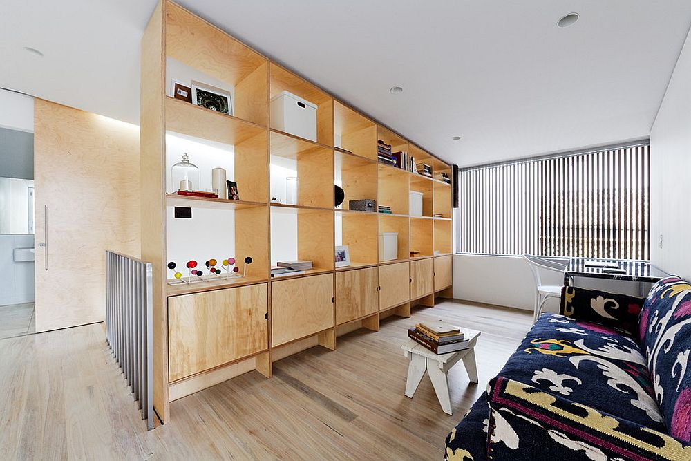 Make the most out of your room divider by using it as a display and storage unit [Design: Join Constructions / Andrew Benn]