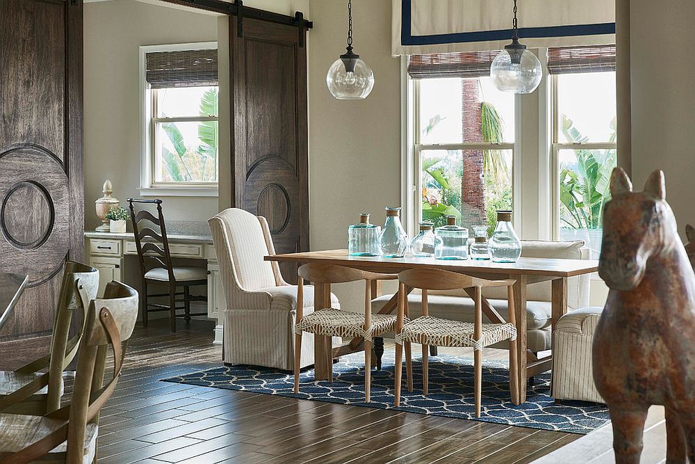 Mediterranean style dining room with beautiful barn doors