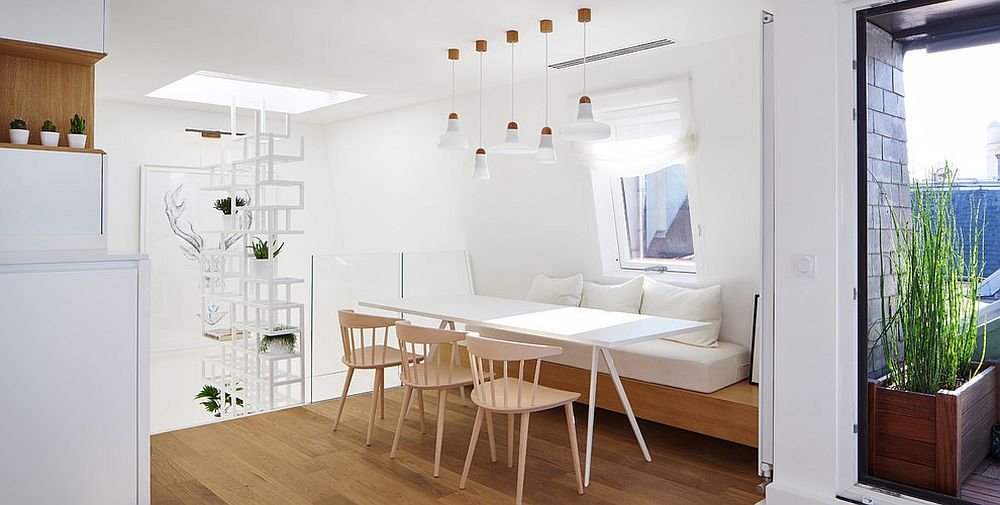 Minimal design of the banquette accentuates the Scandinavian style of the dining area