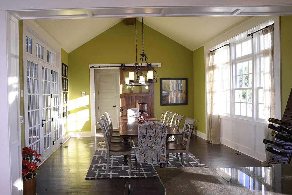 Modern dining room in green with sliding barn door