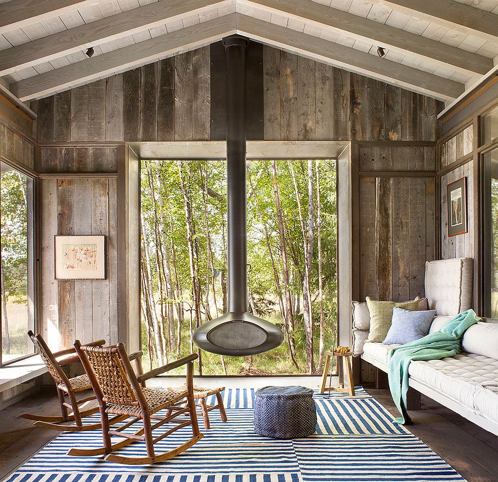 Modern fireplace at the heart of rustic sunroom [Design: Pearson Design Group]