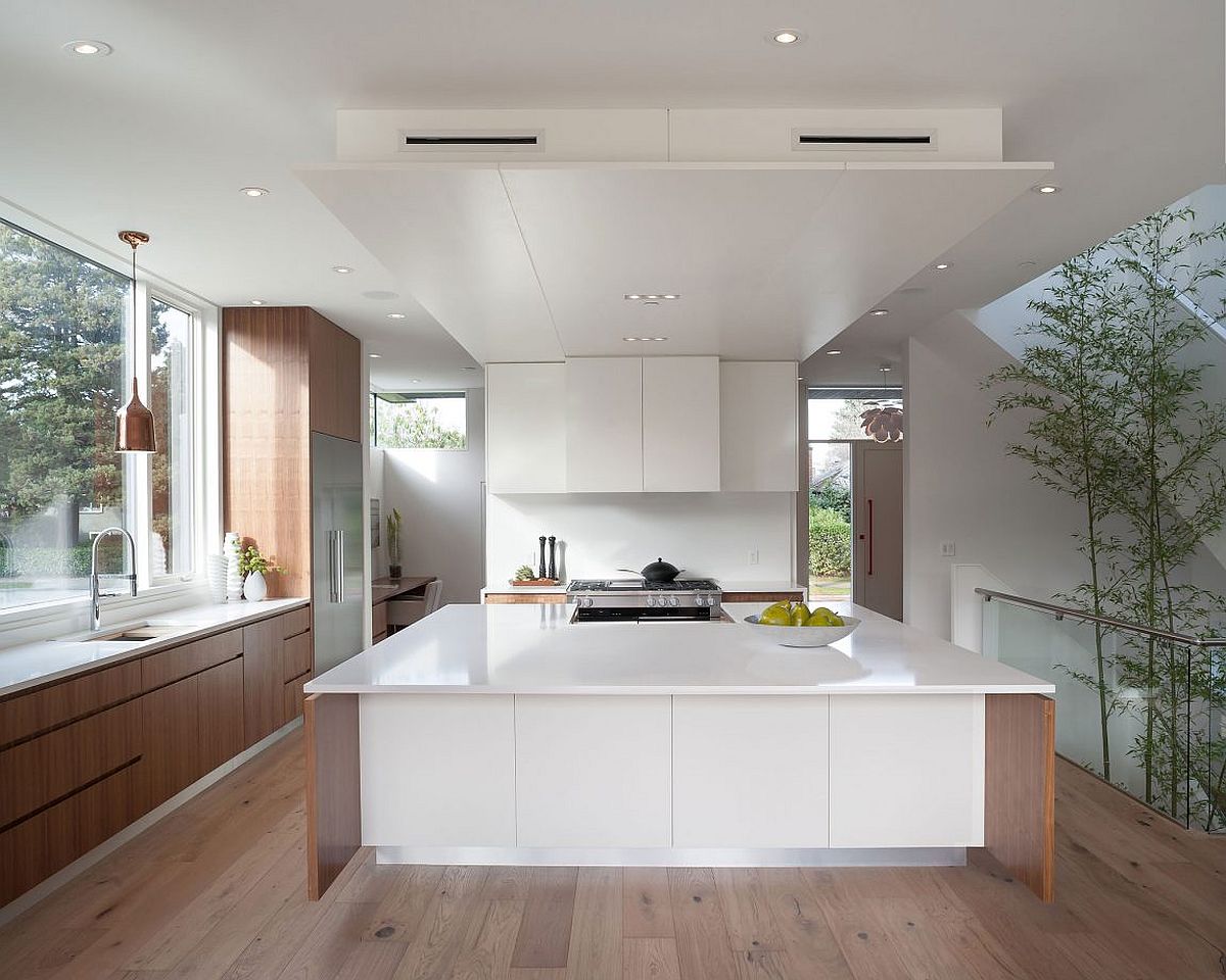 Modern kitchen in white coupled with warmth of wood