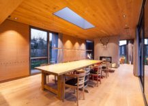 Oke-celing-and-floors-coupled-with-wooden-walls-and-a-cozy-fireplace-in-the-dining-room-217x155