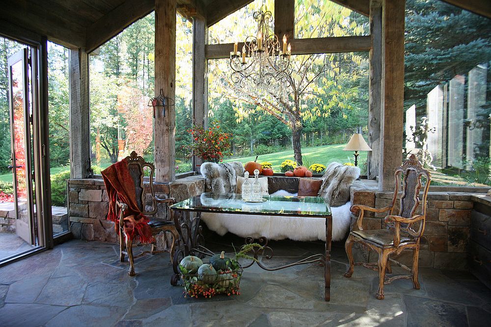 Picture-perfect rustic sunroom with sitting nook and unassuming décor [Design: Alexandra Lauren Designs]