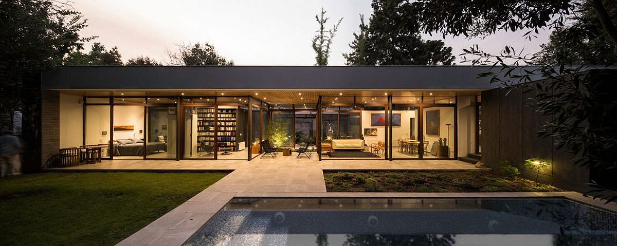 Pool area and garden of the stylish and open Chilean house