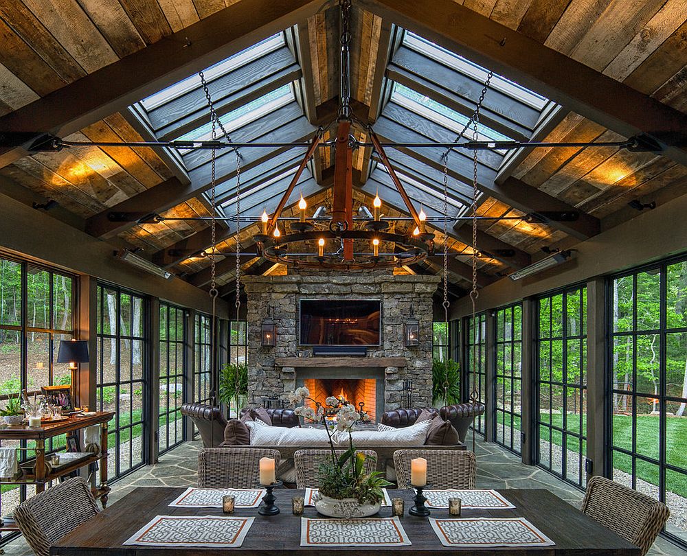 Skylights bring in additional ventilation into the stunning rustic sunroom