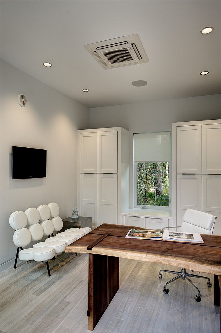 Slab of reclaimed wood used to craft the desk in the home office