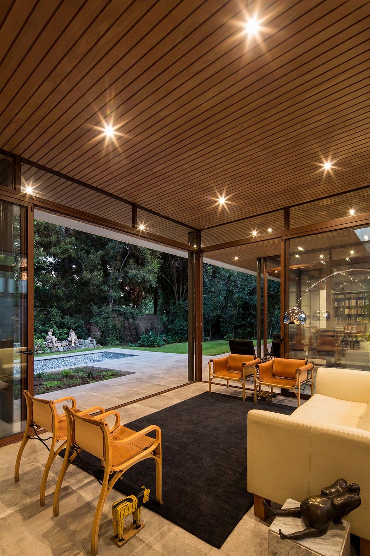 Sliding glass doors connect the sitting area with the garden