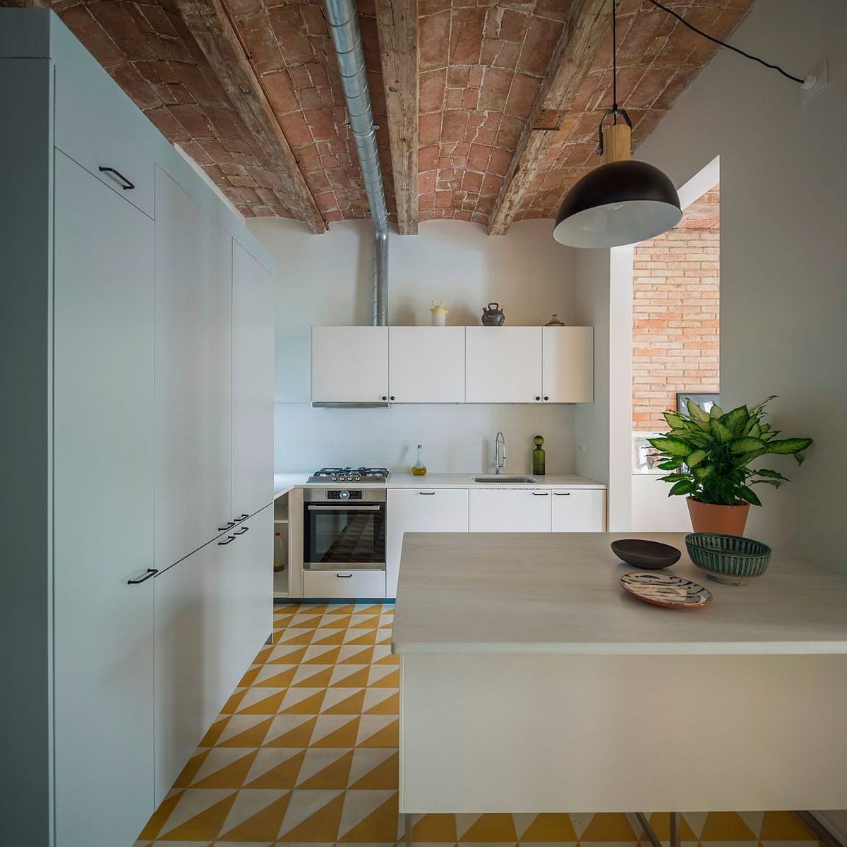 Small modern kitchen design with white cabinets and bright floor tiles