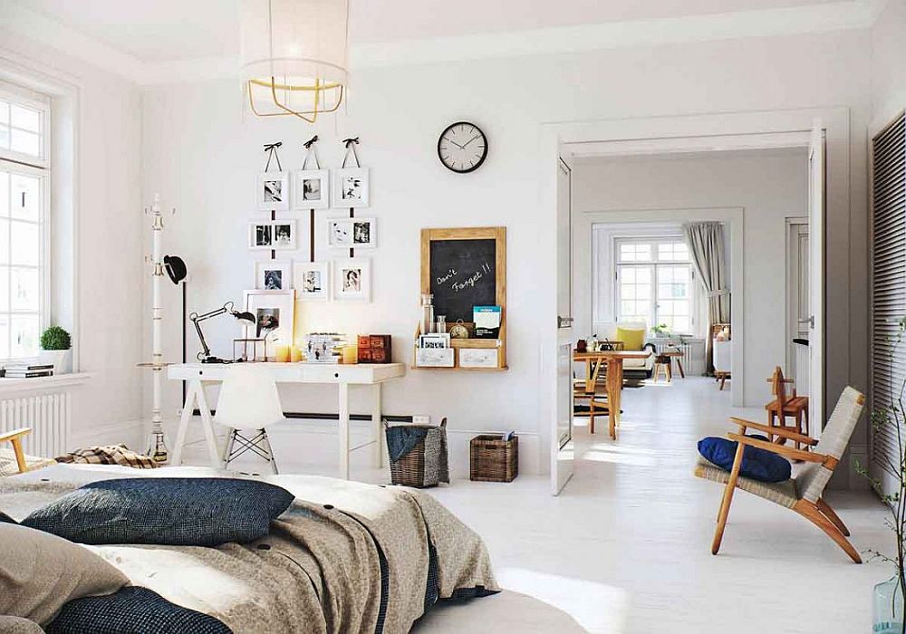 Spacious Scandinavian bedroom design in white with small workstation