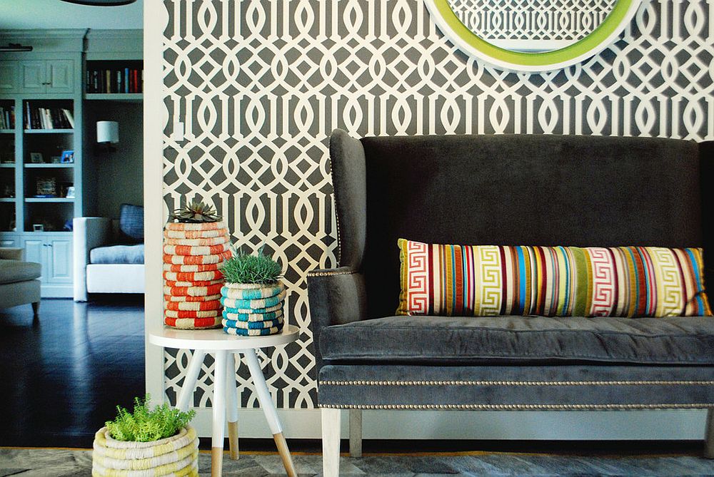 Striking entry design with trellis pattern wallpaper and gorgeous loveseat [Design: Rethink Design Studio]