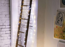 String-lights-illuminate-a-corner-ladder-217x155