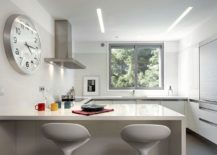 Stylish-and-space-savvy-contemporary-kitchen-in-white-with-breakfast-zone-217x155