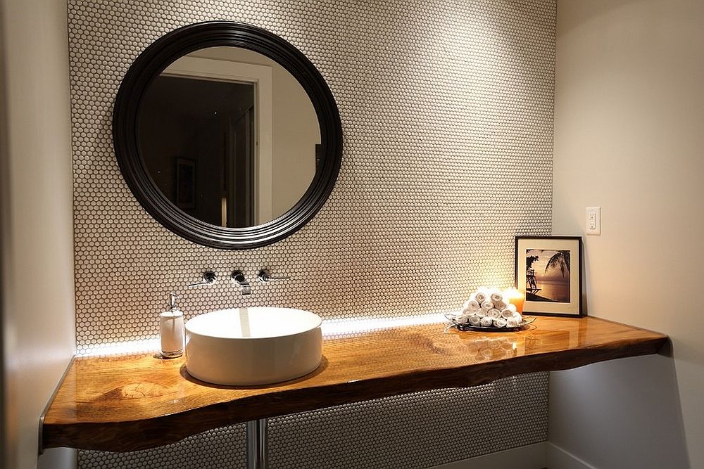 Stylish contemporary powder room with live edge vanity and penny tiled walls