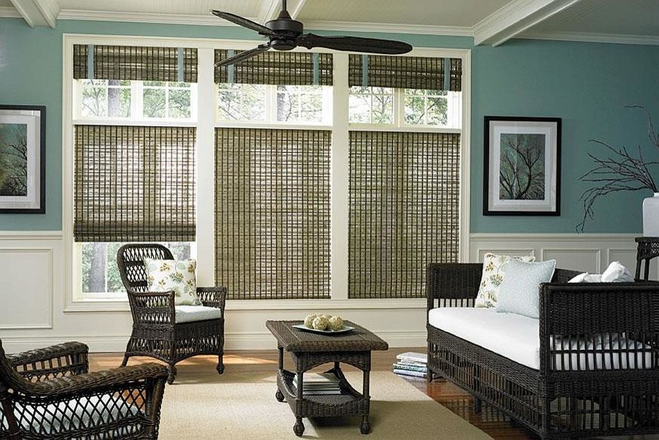 Sunroom in teal with woven shades and rattan décor [Design: Phelps Enterprises]