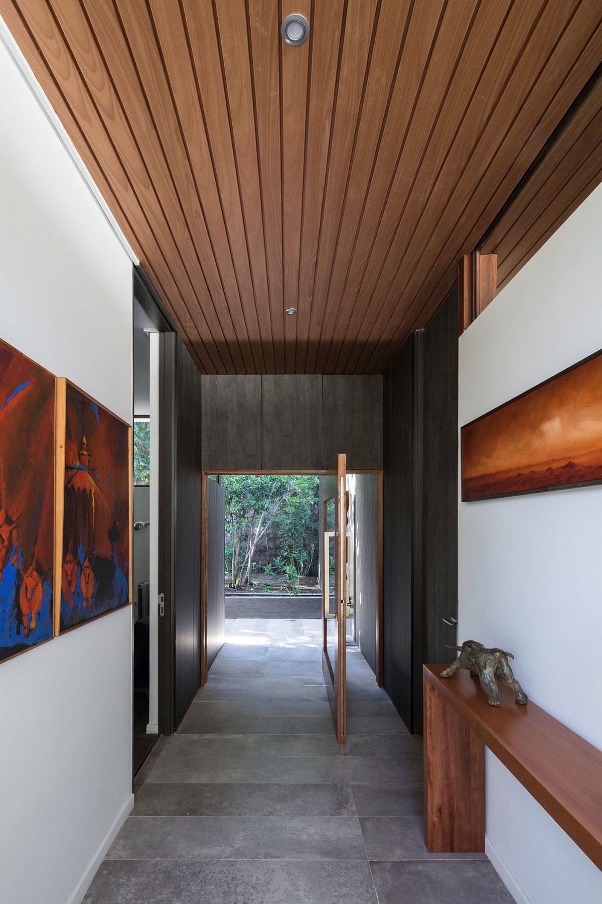 Swiveling door and smart foyer create a unique entry