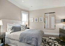 Taupe-bedroom-with-dark-wooden-floors-217x155