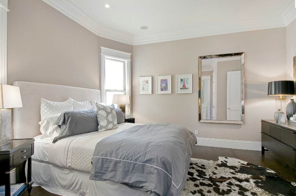 Taupe Bedroom With Dark Wooden Floors 