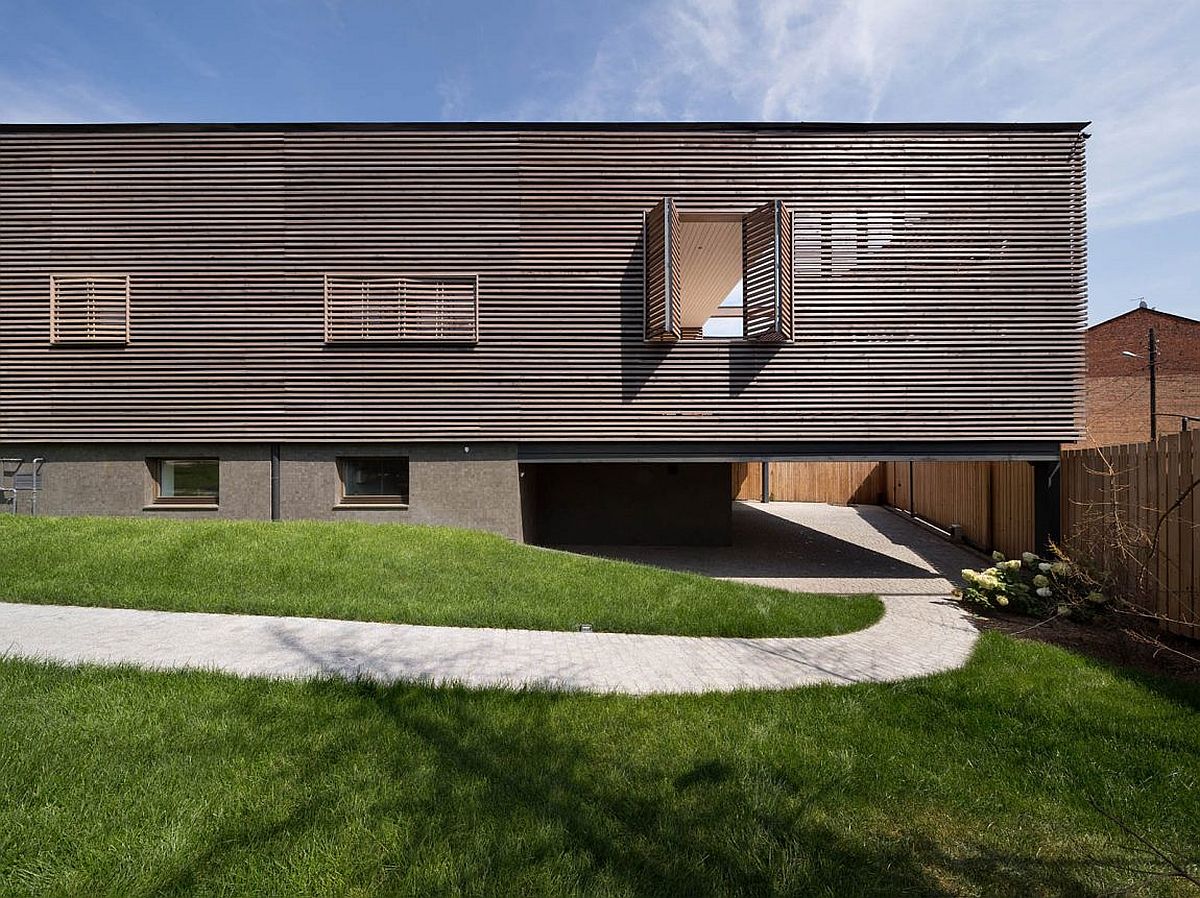 Timber slats that shape the facade also filter in natural light