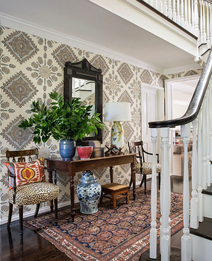 Transitional entry with wallpaper that adds classic pattern to the room [Design: Burnham Design]