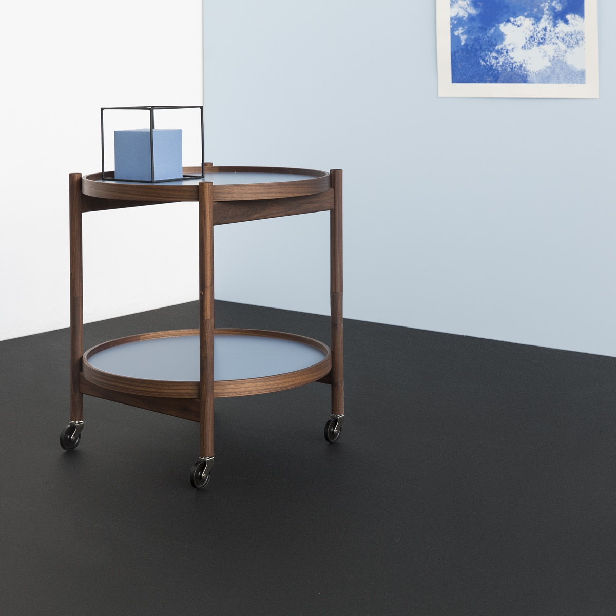 Hans Bølling's designed his classic Tray Table in 1963. A midcentury Danish design icon, the Tray Table is both aesthetically pleasing and functional. The Bølling Tray Table is pictured in a Storm Blue colour. Image courtesy of Brdr. Krüger.