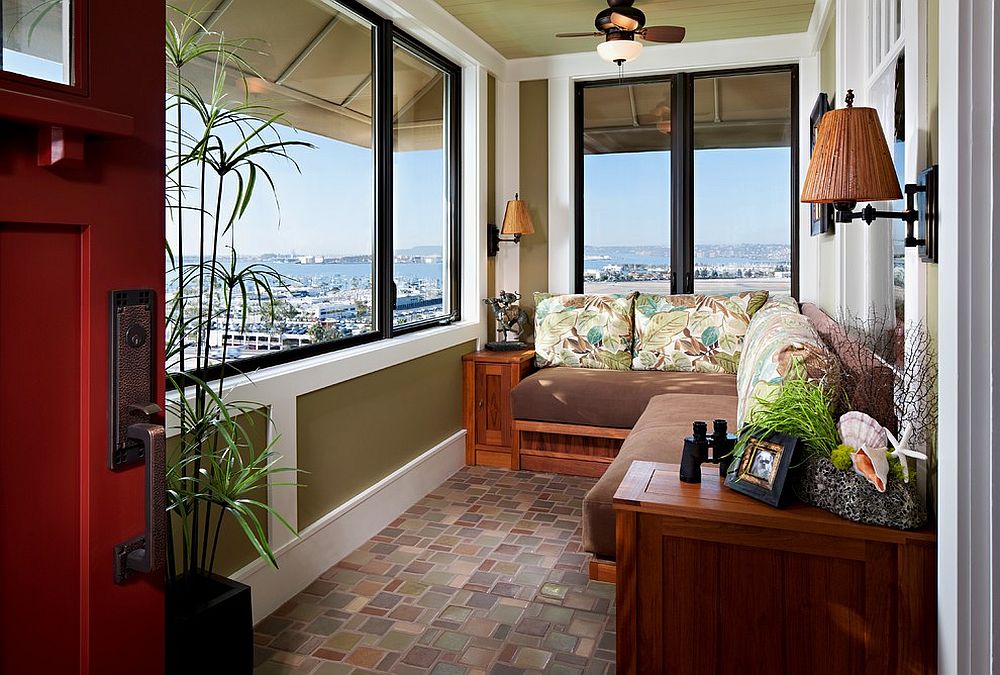 Tropical sunroom with a lovely view of San Diego and built-in teak settee [Design: Lani LoCoco Living]