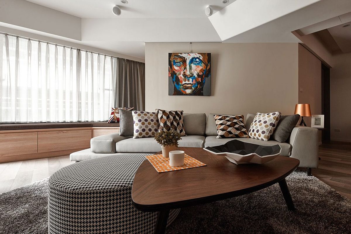 Tufted ottoman and stylish coffee table at the heart of the round living space