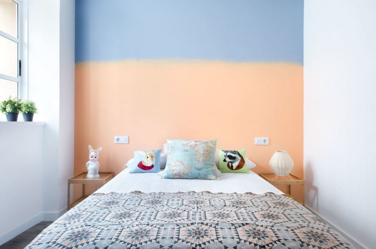 Two-toned wall in an eclectic bedroom