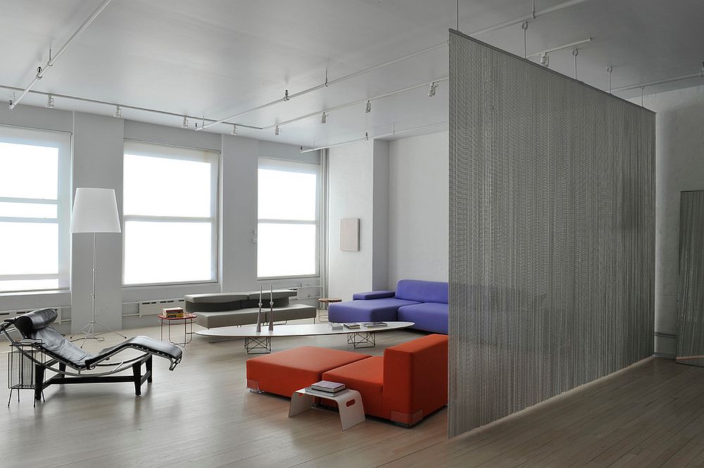 Wire mesh used as room divider in the contemporary living room of New York home