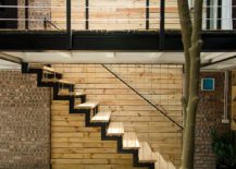 Wood-and-brick-surfaces-add-textural-beauty-to-the-small-interior-217x155